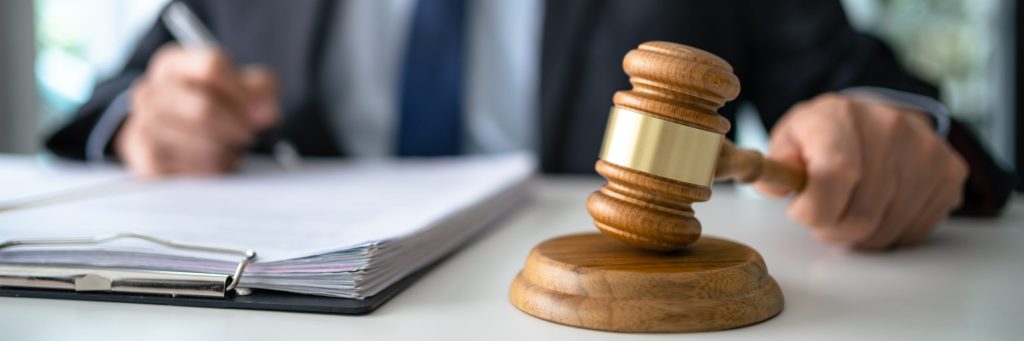 Lawyer Legal counsel presents to the client a signed contract wi